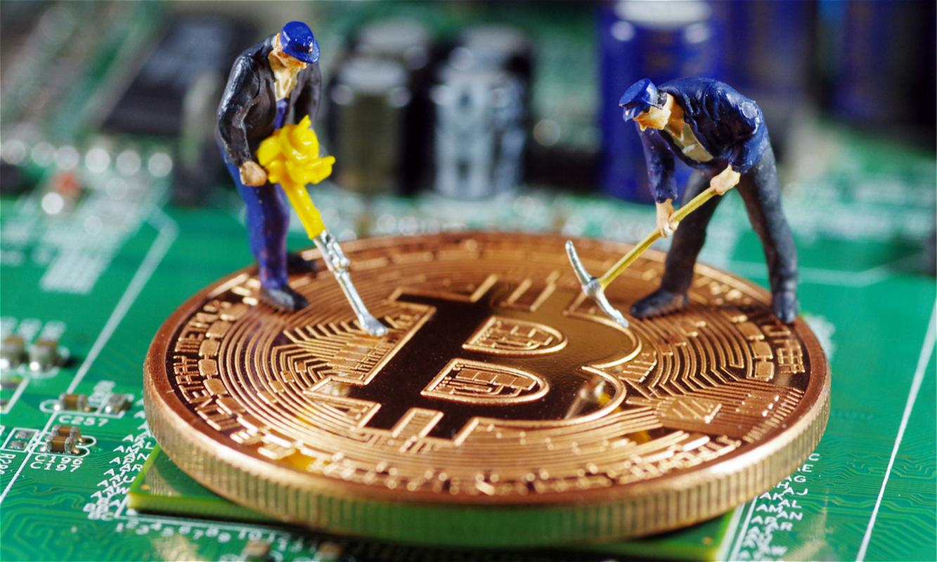 A miner closely monitoring the performance of his mining rigs, ensuring optimal efficiency and stability.